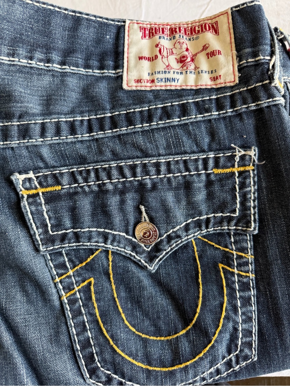 True Religion men’s street cut Jeans in Dark Indigo with Yellow Stitching